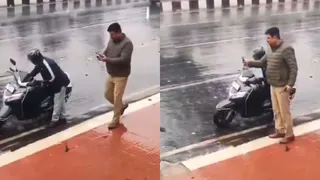 UP News: Police issued challan to vehicles when people stopped on roadside to avoid rain in Lucknow, video goes viral